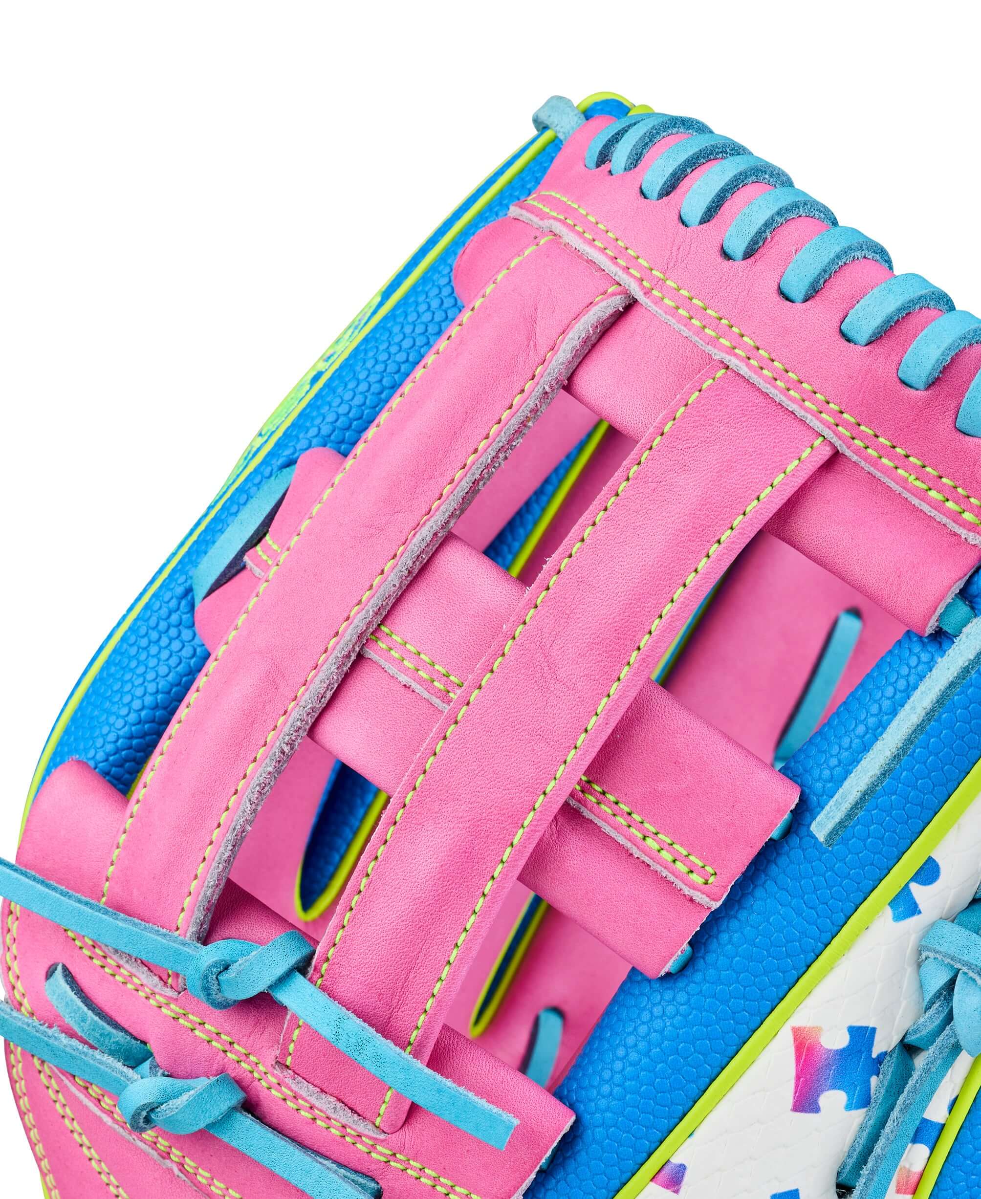 Wilson 2026 Love the Moment A2000 1777 glove with pink H-web, blue lacing, close-up web detail.