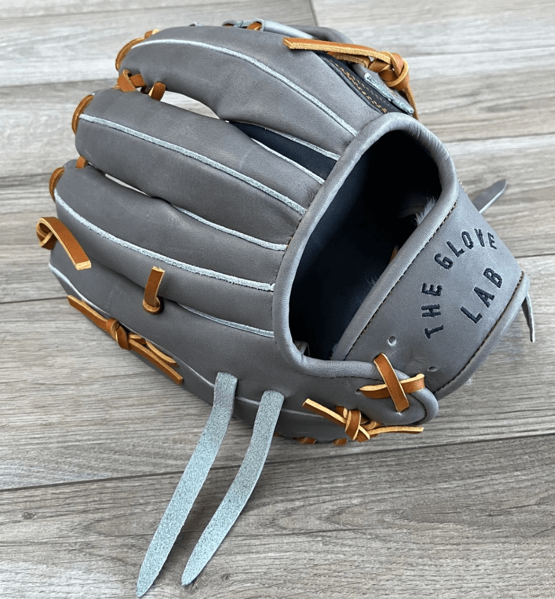 The Glove Lab 11.5" Single Post glove in grey and navy, crafted from Japanese tanned US Steerhide, showcasing quality design.