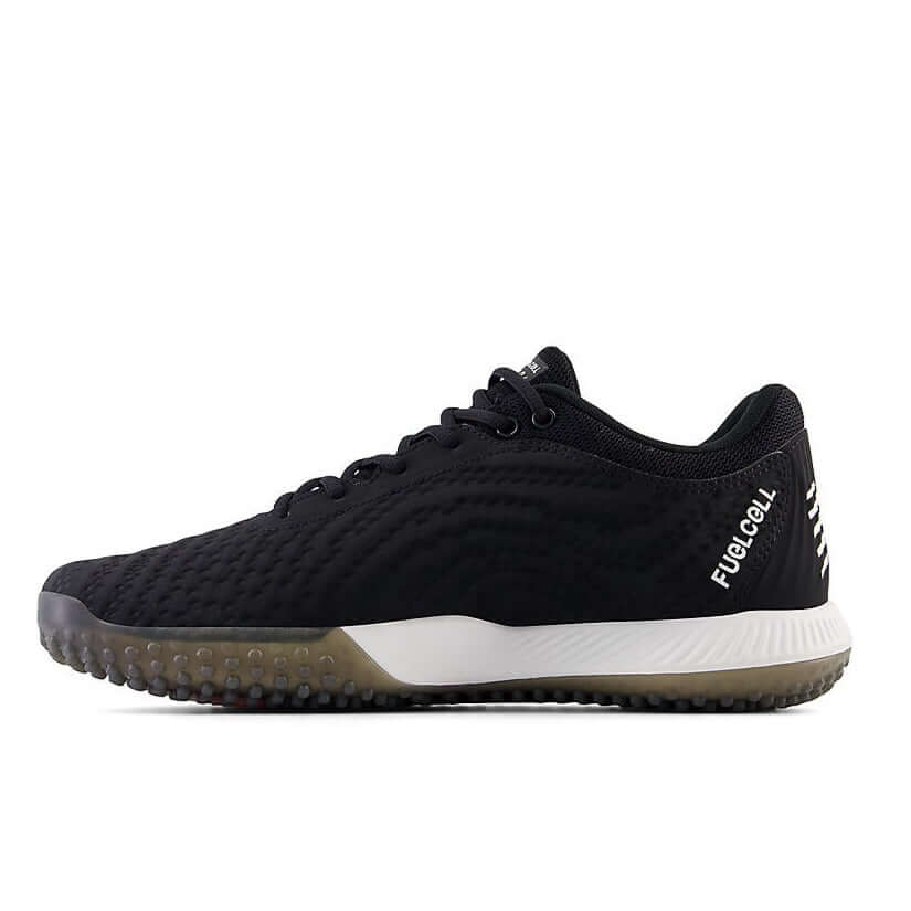 New Balance FuelCell 4040v7 Turf Trainer in black, showcasing its lightweight design and aggressive rubber outsole.