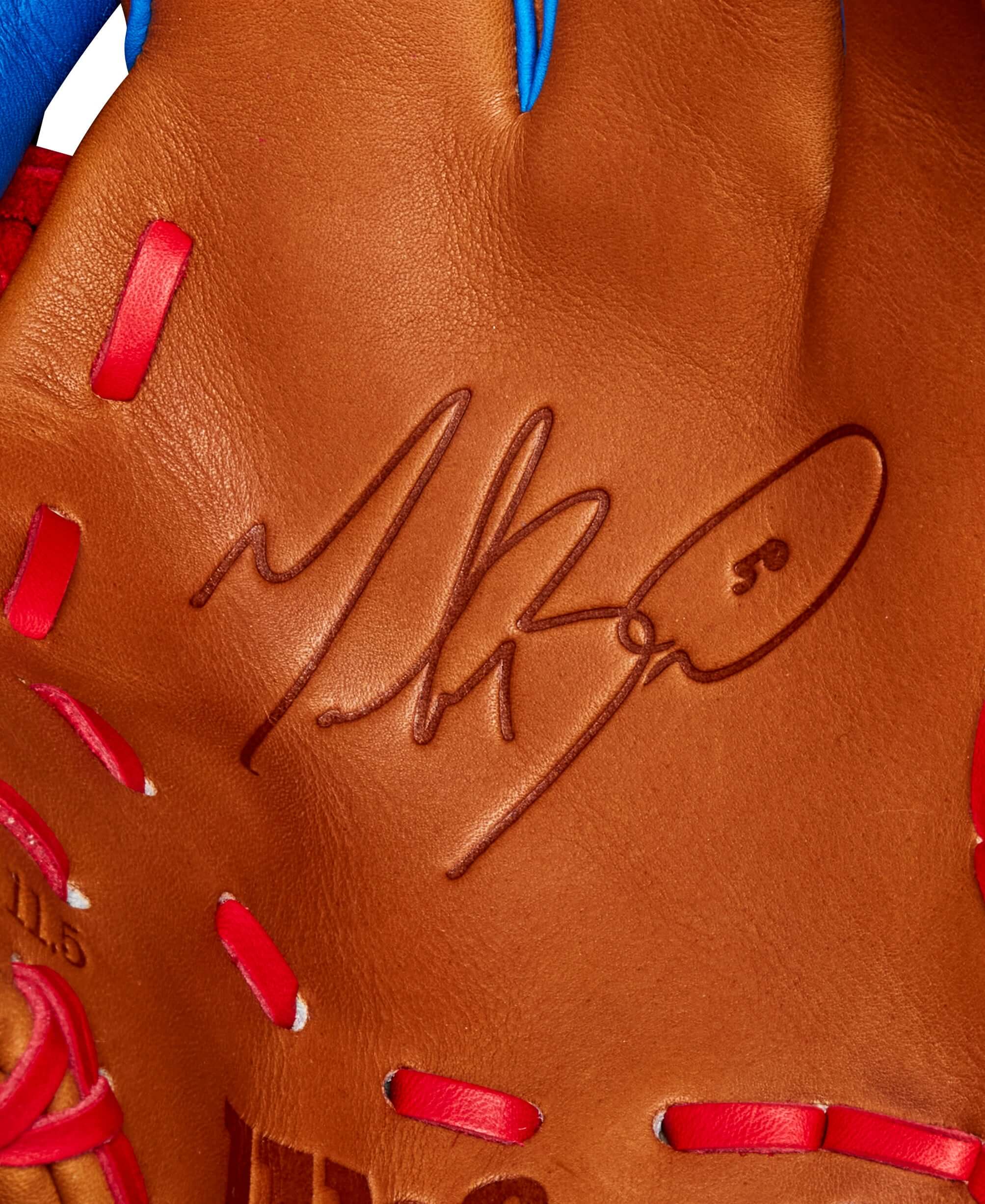 Close-up of the Mookie Betts A2K 1786 baseball glove featuring his signature on luxurious Saddle Tan leather.