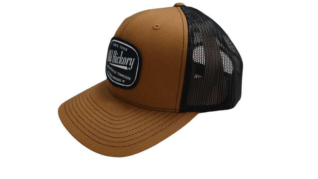 Old Hickory Steel Pressed Patch Cap in caramel and black with snapback design and sublimated patch logo.