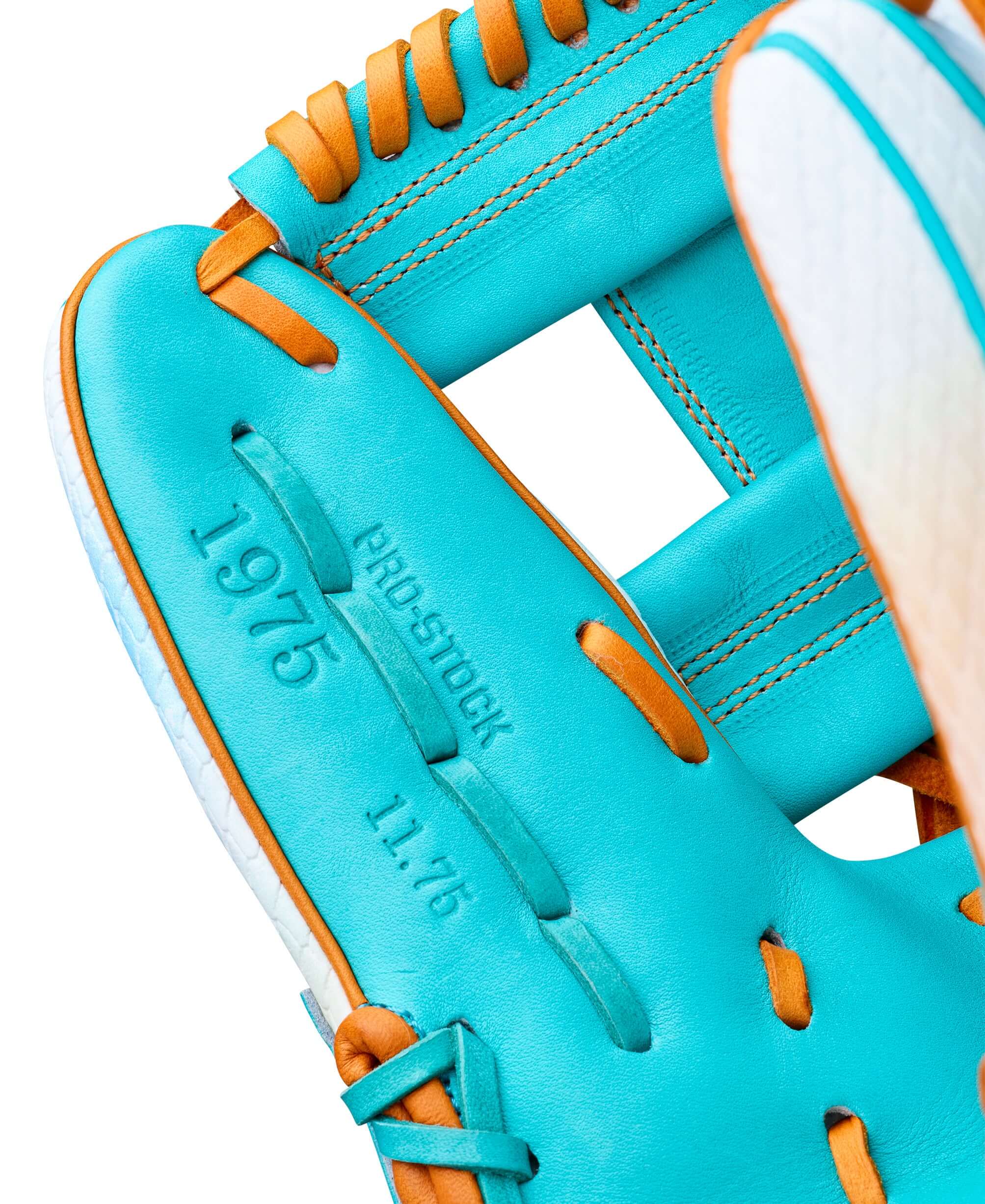 Close-up of the Wilson A2000 1975S baseball glove showcasing its turquoise leather and stitching details.