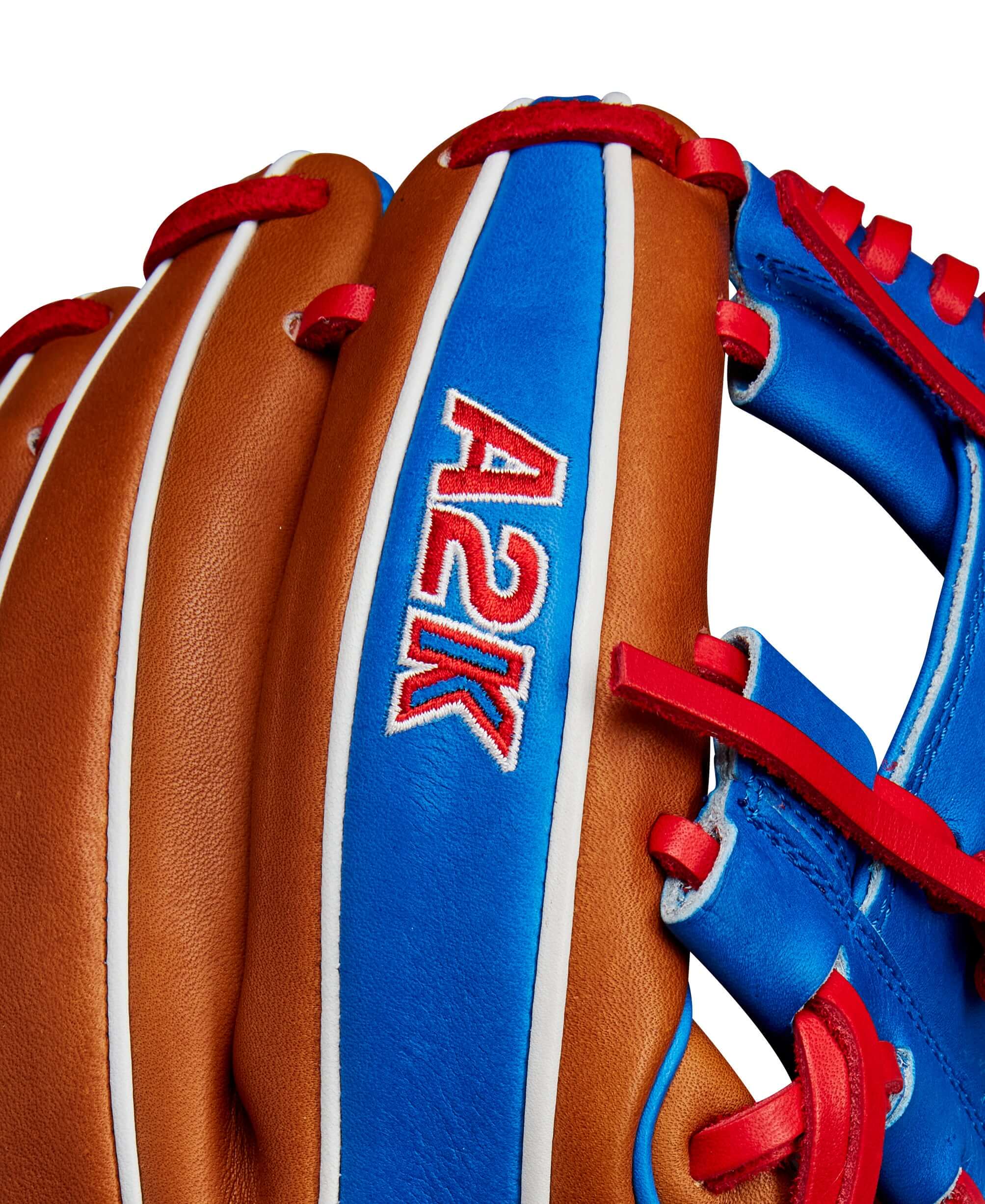 Close-up of Wilson A2K Mookie Betts glove with Saddle Tan and Royal blue leather detailing.