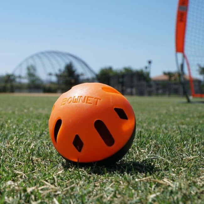 Alt tag for image of Bownet Snap Back Mini Training Balls: Bownet Snap Back Mini Training Balls poly-flex 9-inch collapsible baseballs for training.